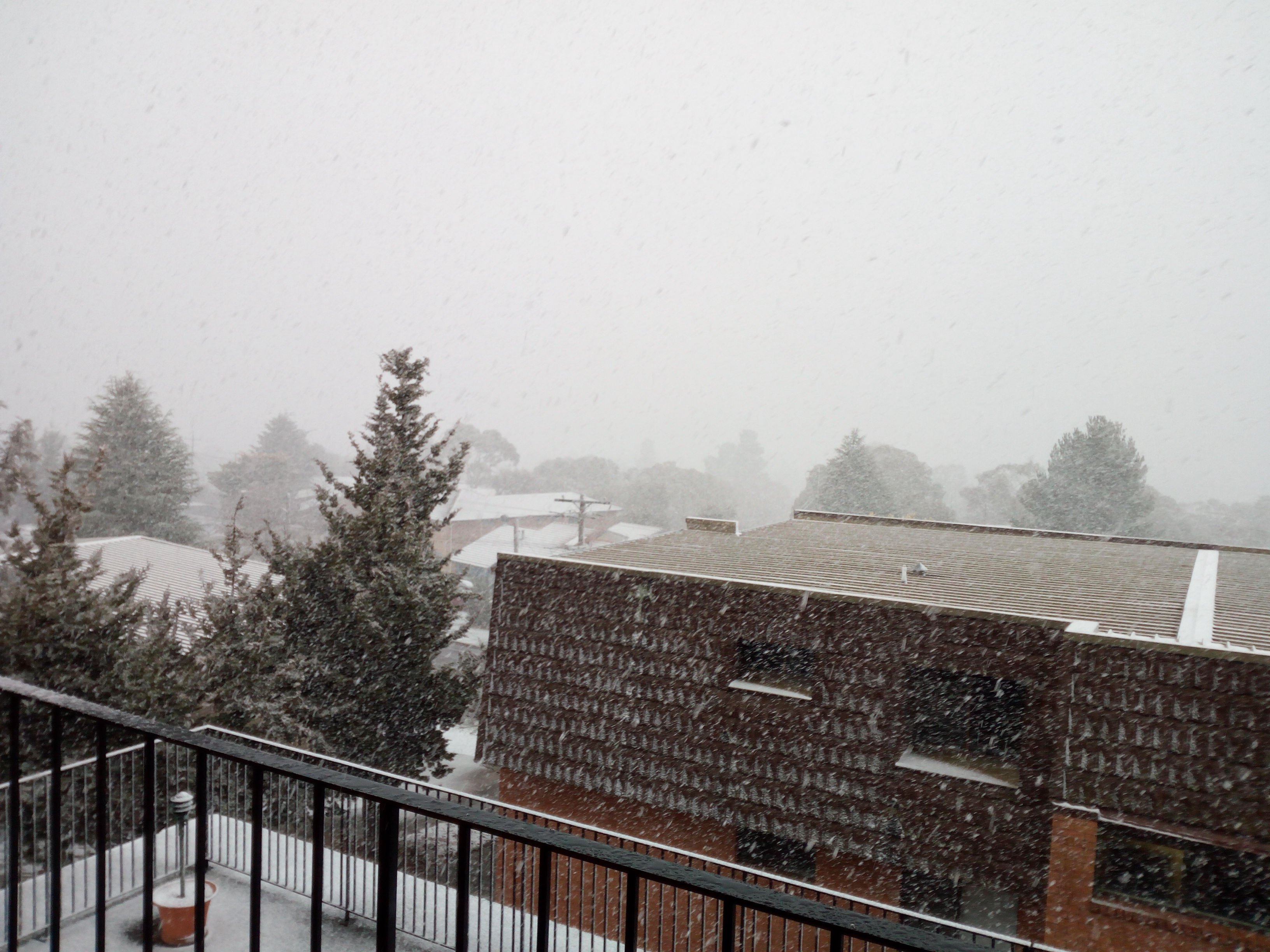 View from balcony during snowstorm